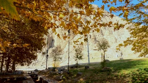 Carved into the side of Kuh-e Bisotun (Mt Bisotun) is a series of bas-reliefs Stock Footage 276505275