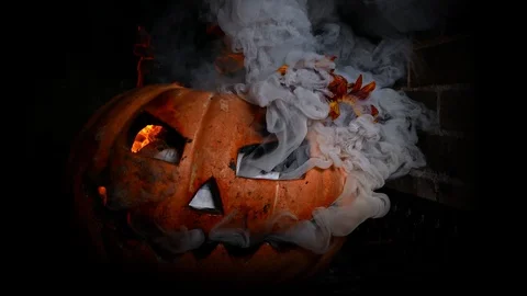 Carved terrible pumpkin, in hellfire. A crazy face from the eyes burns fire. Stock Footage 116893987
