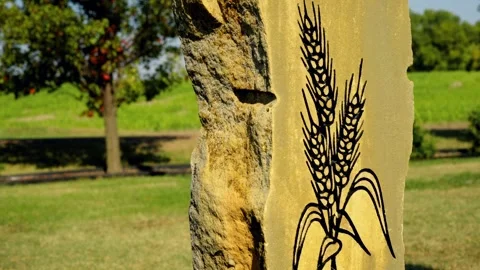 Carved wheat design on a stone marker at the geographic center of the United Sta Video stock 345531134
