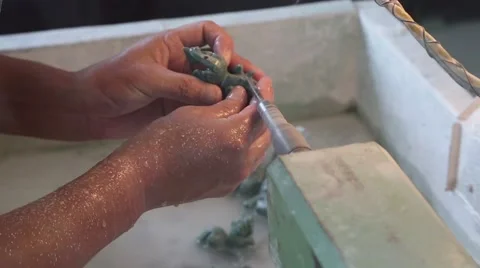 Carver of stone makes the machine jade figurine in traditional oriental style Stock Footage 51945123