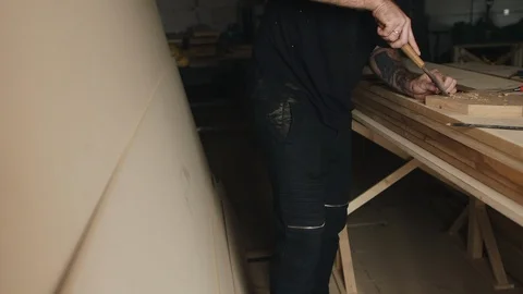 Carver work on linden wood using the chisel. Carpenter working in workshop. Stock Footage 89303158