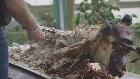 Carving and serving hog roast 4k Stock Footage 247331266