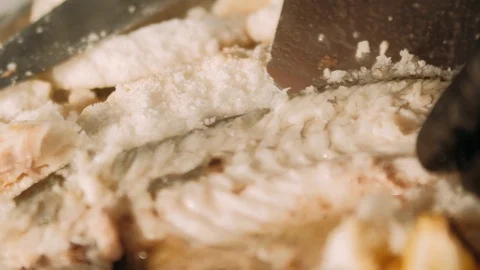 Carving baked fish Stock Footage 125458640