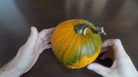 Carving a Halloween pumpkin Stock Footage 123727381
