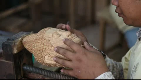 Carving out a Buddha head statue Stock Footage 10727299