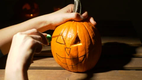 Carving out pumpkin process, halloween, decoration and holidays concept Video stock 120280732
