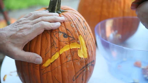 Carving a pumpkin face Stock Footage 42936302