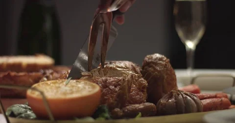 Carving roasted chicken on a festive table Stock Footage 82994473
