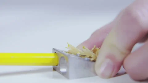 Carving sharpening pencil in white background, slow motion Stock Footage 58761335