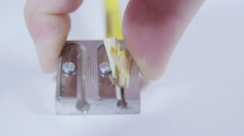 Carving sharpening pencil in white background, slow motion Stock Footage 58761348