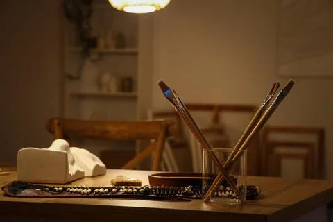 Carving tools on table in sculptor's workshop, closeup Stock Photos