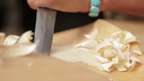 Carving totem pole by indigenous native man close up with special knife Stock Footage 75736297