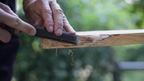Carving wood plank using chisel, close-up Stock Footage 156664648