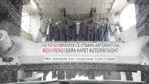 Carwash From Inside: Automatic Car Wash Cleaning Windshield. Point of View Stock Footage 318671144