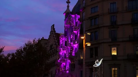 Casa Batlló lighting up in purple at night Stock Footage 203534032