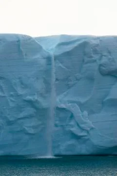 Cascade in an ice wall Stock Photos