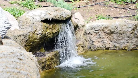 Cascade of little small decorative beautiful tropical waterfall in mountain bota Stock Footage 280120486