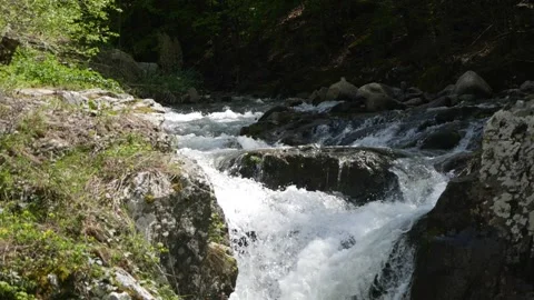 Cascade on mountain stream, slow motion Stock Footage 153907749