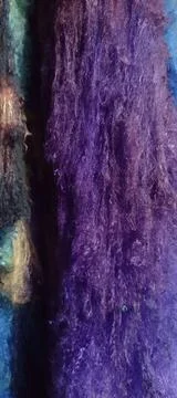 Cascade of purple silk lapp threads Stock Photos