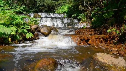 Cascade of small waterfalls Video stock 73934382