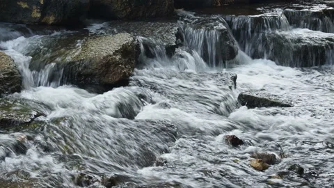 Cascade of small waterfalls of a mountain river among the boulders Stock Footage 162061003