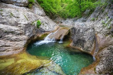 Cascade Water cascade in green spring forest. Copyright: xZoonar.com/Galyn... 스톡 사진