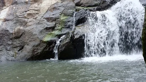 Cascade of water falling from a cliff Stock Footage 82813631