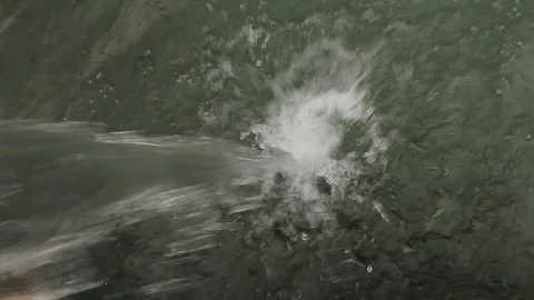 Cascade of water pouring down in a manmade pool on a farm in Santander Stock-Footage 88380792