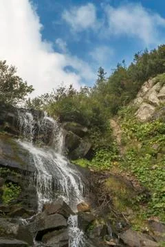 Cascade waterfall in the mountains Stock Photos