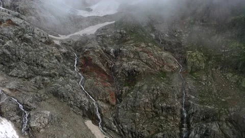 The cascade waterfall over rocky rugged mountain slope. The rough river stream Stock Footage 169749109