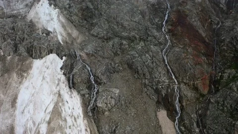 The cascade waterfall over rocky rugged mountain slope. The rough river stream Stock Footage 169749153
