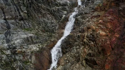 The cascade waterfall over rocky rugged mountain slope. Rough river stream Stock Footage 169749216