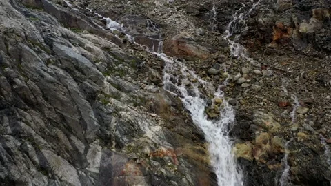 The cascade waterfall over rocky rugged mountain slope. Rough river stream Stock Footage 169749340