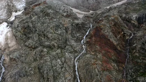 The cascade waterfall over rocky rugged mountain slope. The rough river stream Stock Footage 169749475