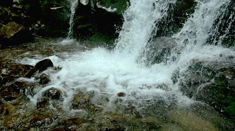 Cascade waterfall splash on stones in forest among mountains. 스톡 동영상 65491519