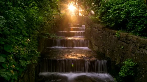 Cascade waterfall in the sun rays timelapse, Sofiyivsky Park, Ukraine 動画素材 72154515