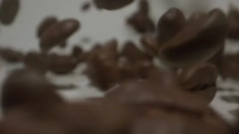 Cascading coffee beans slow motion 1000fps Stock Footage 144704174