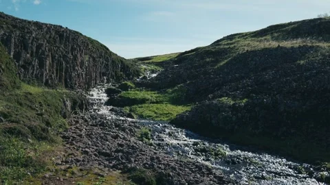 Cascading creek through rocks in winter Stock Footage 263779280