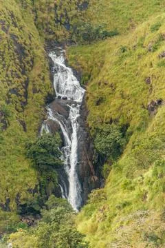 Cascading Mountain Waterfall Through Lush Green Kerala Slopes Stock Photos