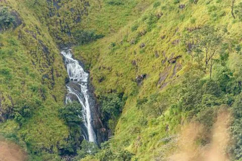Cascading Mountain Waterfall Through Lush Green Kerala Slopes Stock Photos