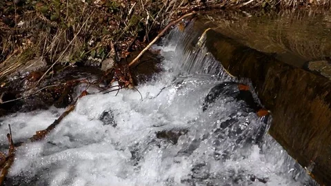 Cascading river flowing directly from the mountains Stock Footage 128237244
