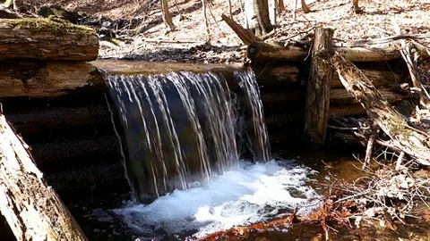 Cascading river flowing directly from the mountains Stock Footage 128237769