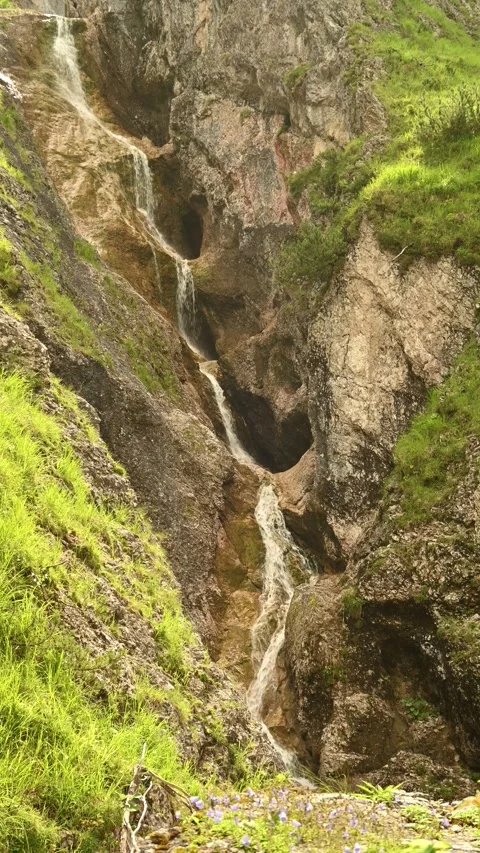 A cascading stepped waterfall in summer, vertical shot, Bavarian Alps, Jachenau Stock-Footage 288323173