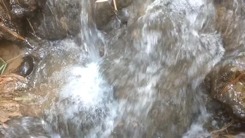 Cascading Stream over Rocky Terrain 스톡 동영상 334761066