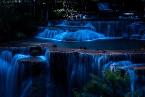 Cascading Tiered Waterfall Flows Over Limestone Terraces At Huai Mae Khamin.. Фото