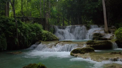 Cascading Tropical Waterfall Flowing Over Limestone Rocks At Huai Mae Khami.. Video stock 341646161