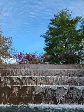 Cascading Water Feature with Trees and Blue Sky Stock Photos