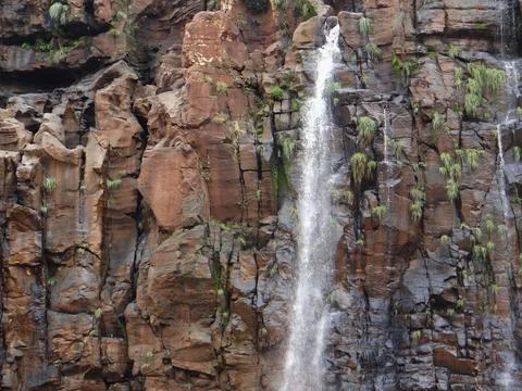 Cascading water on rugged cliffs. Stock Photos