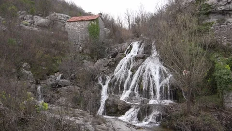 Cascading Waterfall by Ancient Stone Structure. Stock Footage 270521544