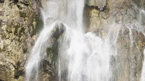 Cascading waterfall flowing through mossy rocks in Plitvice Stock Footage 319777968
